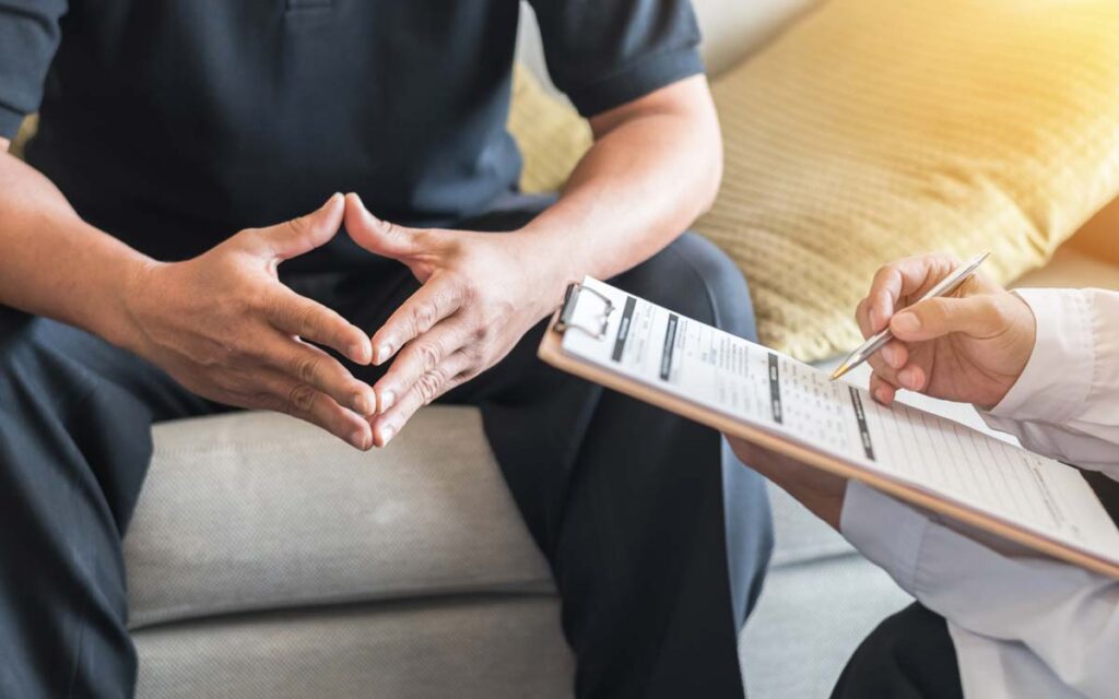 A man talks to his doctor