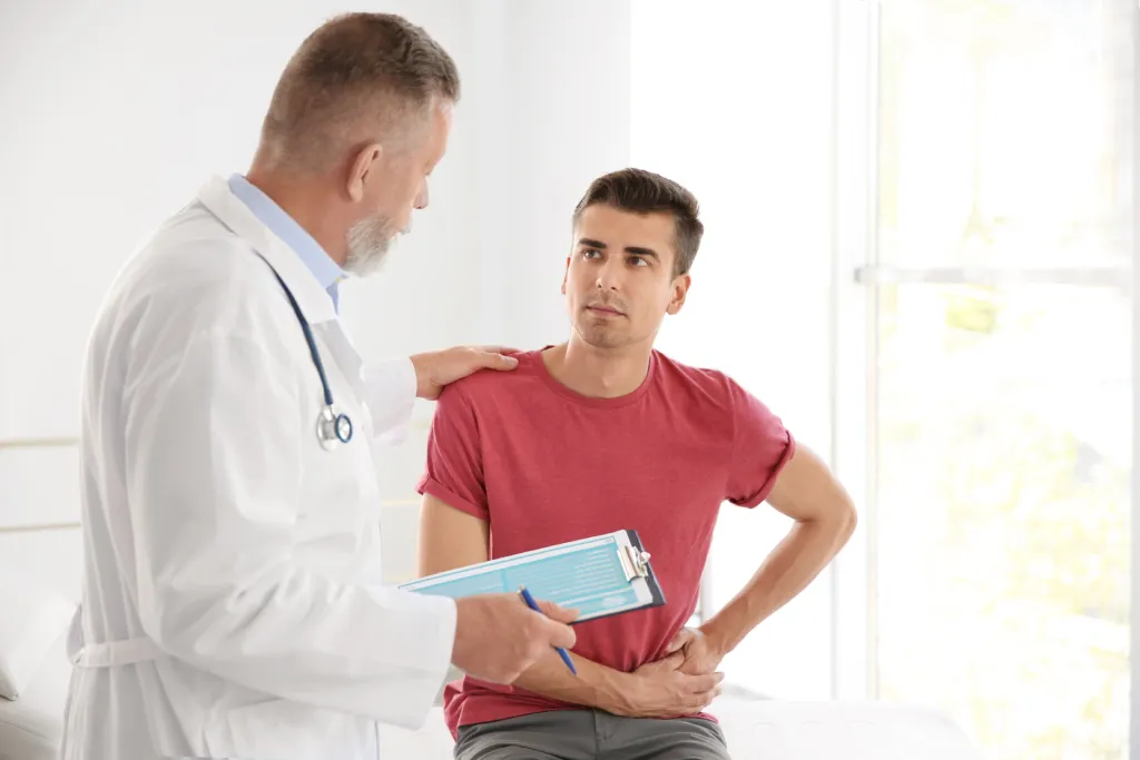 A doctor consults with a man suffering from BPH.