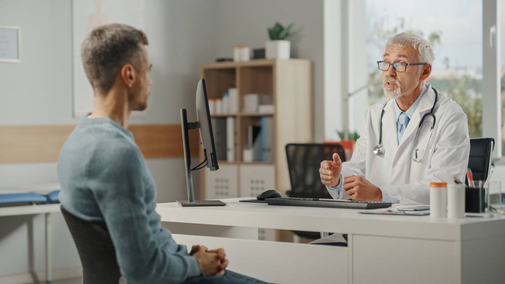 A physician discusses prostate cancer screening options with a patient.